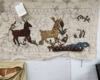 Unfinished hooked rug.