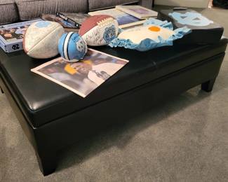 Faux black leather cushioned coffee table