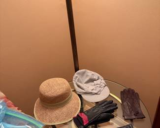 Hats gloves and glass table 