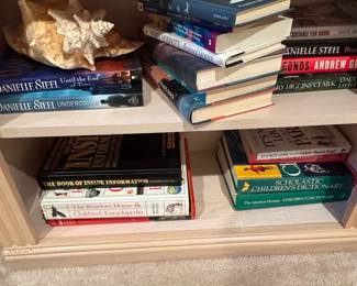 Assorted Books and Seashell Decor
