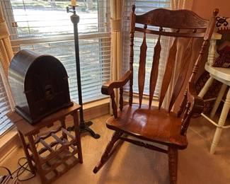 Rocking chair, floor lamp, old-timey-look AM/FM radio, wine rack
