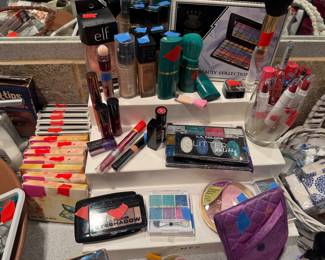 Unopened eye shadow pallets, Mary Kay products, lip crayons