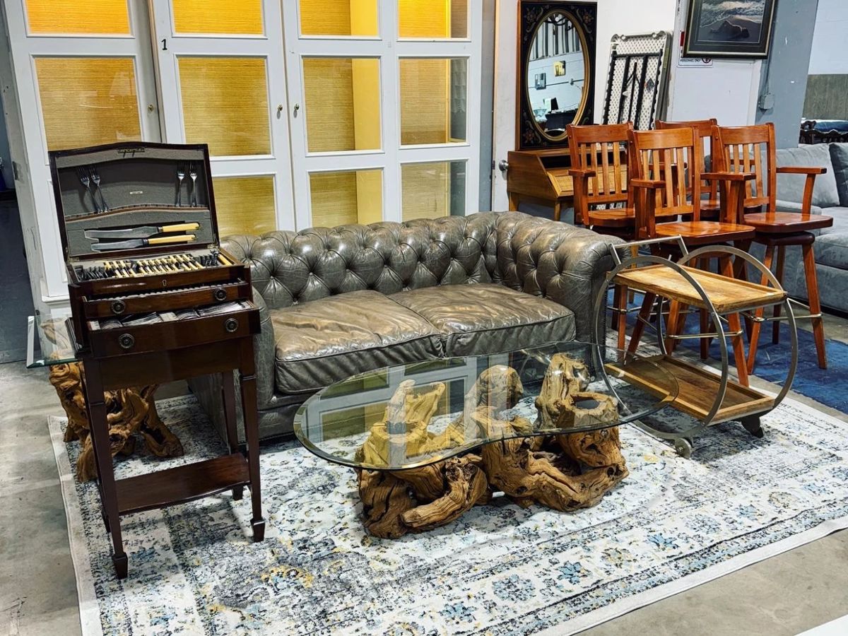 Leather Tufted Sofa, Glass top Root base Coffee and End Tables, Flatware in Chest and Rug Orlando Estate Auction