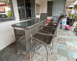 Patio bar with chairs. 