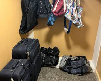 Suitcases, travel bags and two Vera Bradley bags