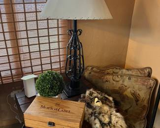 Native wall hanging, metal lamp, wood box and large leather and cowboy print pillows.