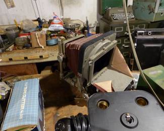 Loaded basement with tools, electronics, vintage cameras, tripods, projectors, vintage aircraft radio receiver and more!!