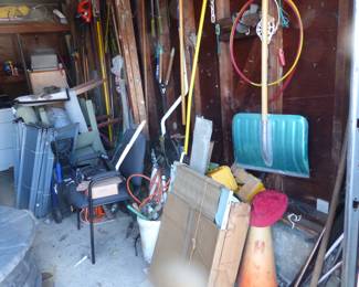 Full garage with assorted things 