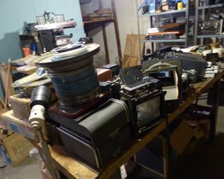 Loaded basement with tools, electronics, vintage cameras, tripods, projectors, vintage aircraft radio receiver and more!!