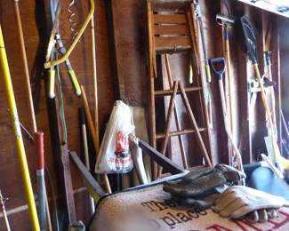 Full garage with assorted things 