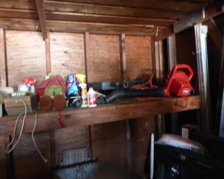 Full garage with assorted things 
