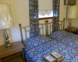 Pair of beds with brass headboards, pair vintage night tables & lamps