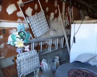 Full garage with assorted things 