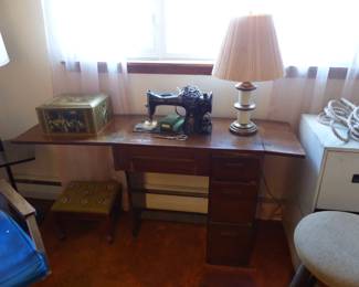 Singer sewing machine in cabinet