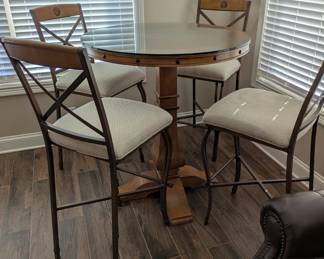 Very nice pub table with 4 barstools from Star Furniture