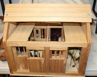 wood horse stable with horses