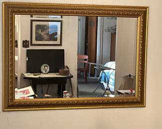 Rectangle mirror inside gold colored frame