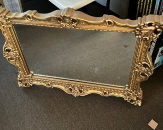 Square sofa mirror inside gold colored frame