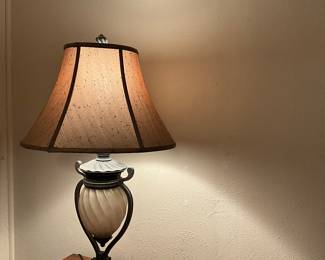 Absolutely gorgeous lamp.  It light up three ways.  The shade, the middle and both.  Very unique.