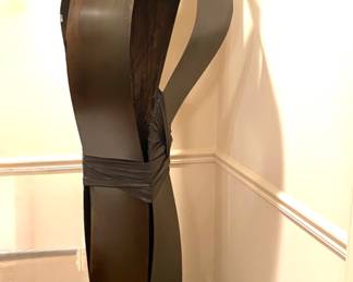 Six-foot metal, wood and vinyl abstract sculpture