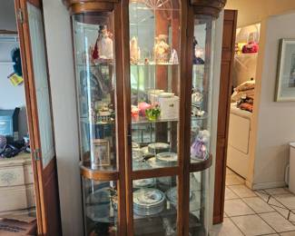 7 ft tall curio cabinet with lights and rounded doors. $100