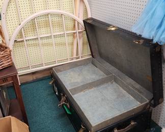 Old iron bed, steamer trunk