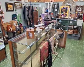 Vintage scarves, glass display cabinets, artwork