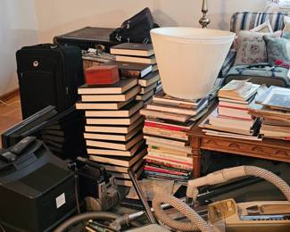 Books, luggage and more furniture, and electronics. There's also a very old trunk.