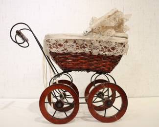 A vintage Victorian style baby doll carriage, 15" x 13" x 9". This item can be shipped
