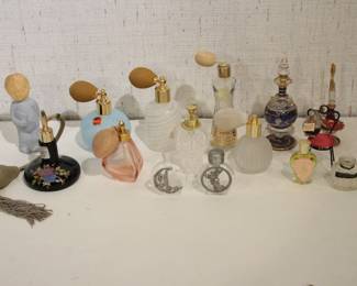 A collection of vintage glass perfume bottles the tallest bottles are 6" with the shortest being 2". These items can be shipped.