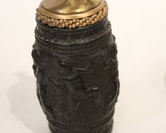 vintage tabletop cigarette lighter 5" tall in a lot with a large pile of vintage matches, a vintage faux tortoiseshell cigarette case with gold-tone trim 4" x 3.5" x .5", and a possible vintage Italian Leonard silver-plated and glass coaster with a starburst design 4". These items can be shipped.