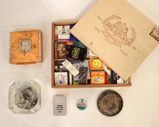 A cigar box 9" x 8" x 1.5" full of vintage matches, Vintage Aztec/Mayan Bronze/Copper & 925 Silver box 4" x 4" x 1", glass ash tray 3.5" x 3.5" x 1", a vintage Mickey Mouse metal souvenir coaster 3", a lighter and a pin. These items can be shipped.