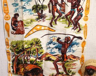 vintage pure linen Australian Aborigines tea towel,  30" x 20", in a lot with Black Americano pieces including, 
vintage Caribbean souvenir doll from Puerto Rico, 12"
watermelon potholders, 8"
off-white cloth with embroidered figures of two children,
a handmade, crocheted yarn doll,
handcrafted or painted ceramic clown, 7"
3 vintage church hand fans,
2 face trivets, 6"
5 post cards, 1 card,
Vintage Little Black Sambo (Whitman Publishing, 1953), heavily worn.
These items can be shipped.
