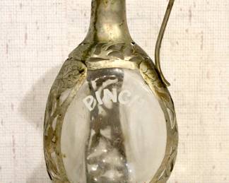 vintage Haig & Haig Pinch dimple whisky bottle with a hand-crafted sterling silver overlay. BUYERS BEWARE, stamp could not be found, the pitcher is strongly believed sterling silver overlay. A 925 stamp could be found on small matching cups. Small matching cups in (lot a different lot) 11" tall. This item can be shipped.