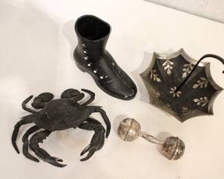 vintage Cynthia Rowley black and silver enamel metal jewelry or trinket holder, 7" x 7"
vintage Reed & Barton silver plate baby rattle in the dumbbell shape, 5"
a vintage EMIG cast metal Victorian boot planter or vase, 6" x 5"
a vintage or antique figural crab inkwell, typically made of cast iron, 7" x 6" x 3"
These items can be shipped