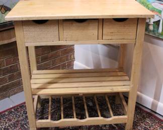 A wooden kitchen island cart, 28" x 15" x 30". This item can not be shipped.