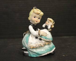 A vintage ceramic Geo Z. Lefton "Twin Figure" girl with a matching doll figurine, 4" in a lot with, a vintage Japanese porcelain figurine of a woman in a bonnet holding a basket, 4", 
Vintage Christmas Angel Playing Harp ART Plastics British Hong Kong, 5" 
Vintage Tall Porcelain Girl In Lace Dress W/Blue Poodle On A Silver Leash, 5"
These items can be shipped.