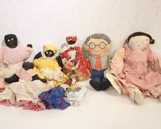 vintage Black Americano folk art cloth dolls that sit on a block, 9", 7", and 10", along with standing wooden doll in red holding a basket, 10", an antique African American rag doll in purple, 9" and a vintage posable Madame Alexander "Flower Girl" doll, 5". A vintage Mattel Grampa pull-string talking doll, likely from 1968 or 1984, 15", and a possible hand made rag doll at 20". These items can be shipped.