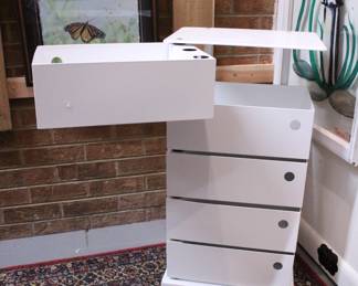 A white metal Dottus-style 5-drawer swivel storage tower, 28" x 15" x 10". This item can not be shipped.