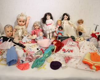 A collection of vintage dolls including, -vintage doll head
-Madame Alexander doll style
-vintage Muffie doll
-vintage 1960s Regal "Drink and Wet" doll
-vintage Madame Alexander baby doll. 
-vintage Madame Alexander Degas Girl doll
-vintage Ginny dolls
-Madame Alexander 8" Japan doll, model number 570
-vintage Madame Alexander Snow White doll. 
-vintage Vogue Jill Walker dolls
-Sweet Vintage Vogue GINNY DOLL
-a Madame Alexander "Blue Boy" doll. 
-vintage baby doll, possibly an Ideal Betsy Wetsy or American Character Tiny Tears doll
-a vintage doll wrapped in a blanket.
-a vintage Tyco Disney The Little Mermaid Original Talking Ariel Doll
These items can be shipped.