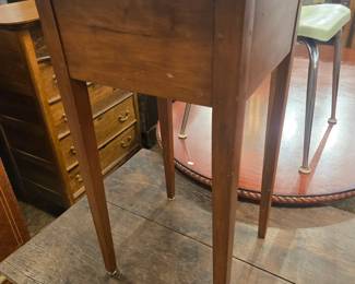 Early cherry tappered leg table w/pegged construction.
