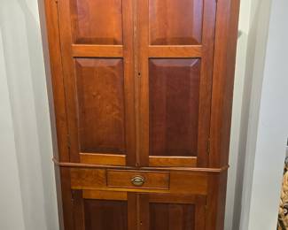 Modern 1 piece cherry corner cupboard.