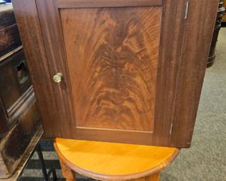 Early flame crotch mahogany hanging corner cabinet