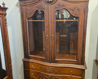 Modern era mahogany 2 piece cabinet curved glass doors.