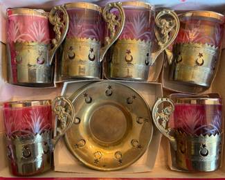 Set of Cut Cranberry Glassware with Brass Holders and Saucers