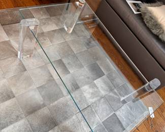 A-MAZE-ING! Interlude Home Glass and Lucite table. You can configure the legs any way you want, the glass simply inserts into the Lucite legs! Even I'm impressed!