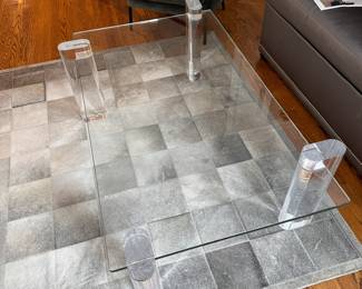 A-MAZE-ING! Interlude Home Glass and Lucite table. You can configure the legs any way you want, the glass simply inserts into the Lucite legs! Even I'm impressed!