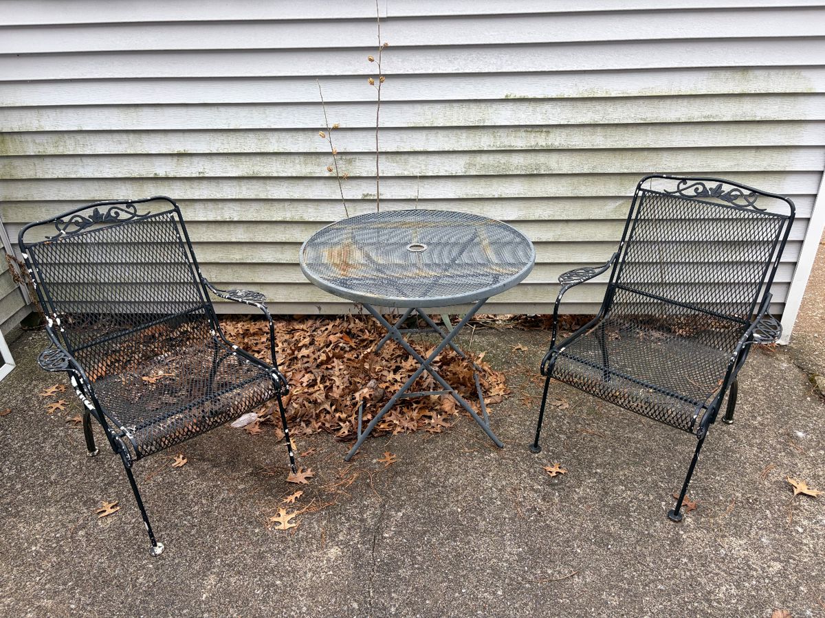 Small patio table and 2 rocking wrought iron chairs $50