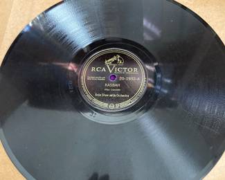 Over 30 books of 33 records that play on the Chaplin turntable, sold separately