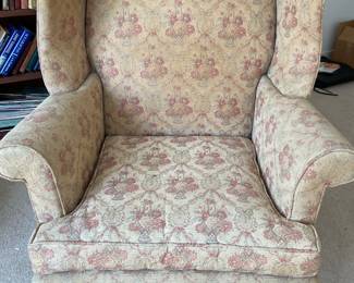 Vintage upholstered wing back chair with nailhead trim